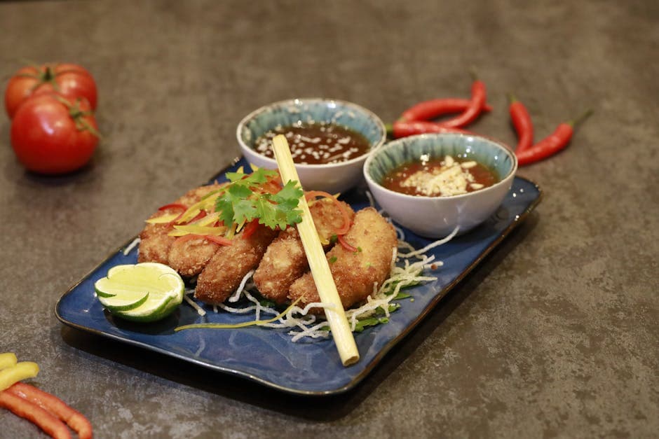 Panert katfisk stekt på panne med rød, ovnsbakt paprika- og limesaus, servert med ristet solsikkefrø