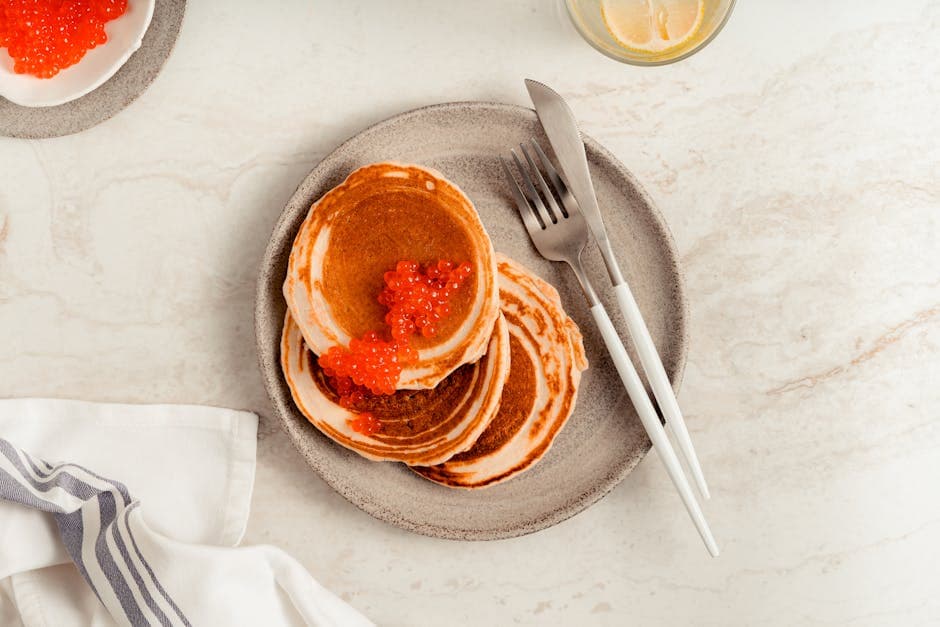 Malangapannekaker med kaviar og vodka-spisskummen-saus