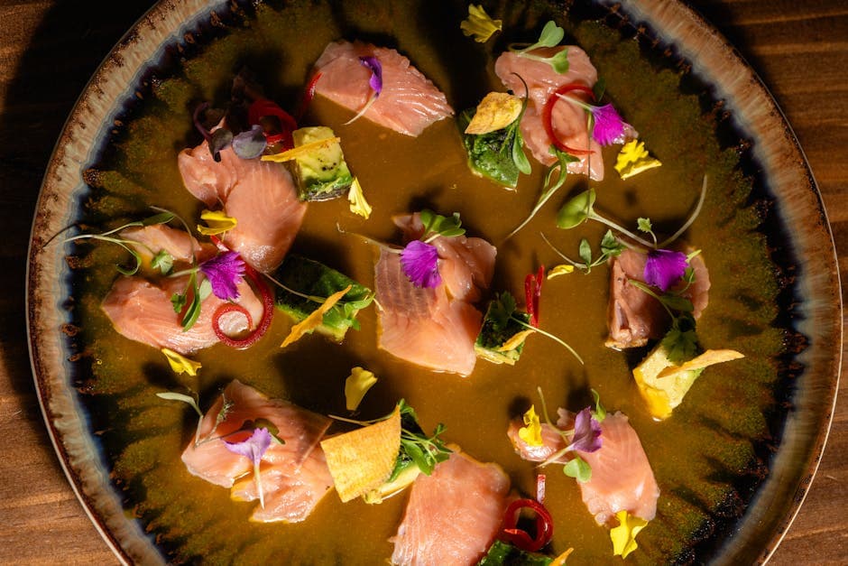 Crudo av havabbor med lime og pinjekjerner