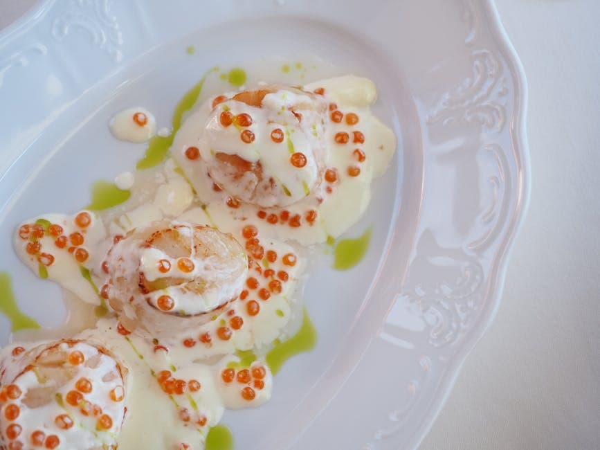 Kamskjell med prosciutto og tomat