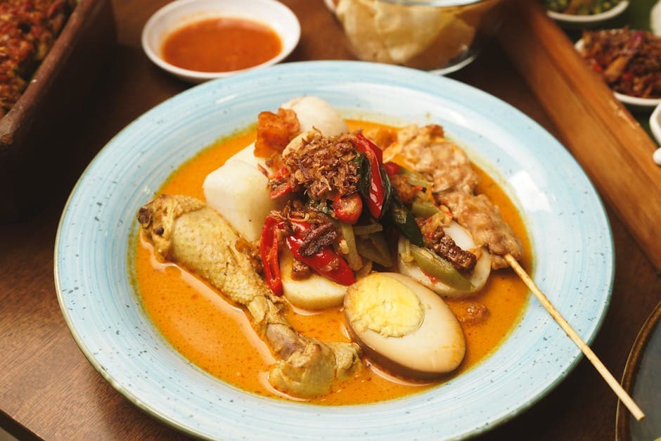 Kylling i karri og kokosmelk med peanøtter