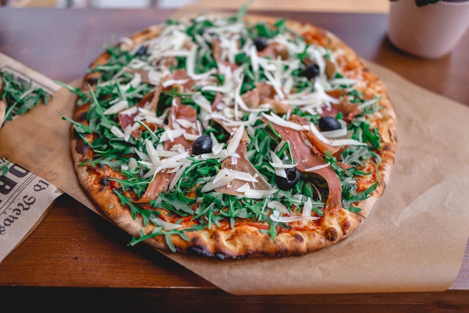 Pizza med ricotta, ruccola, druer og sitronolje