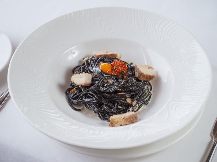 Grillede kamskjell med blekksprutpasta og safranvinaigrette