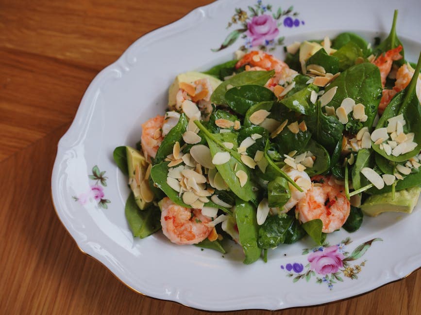 Spinat- og mandelsalat med kumquats